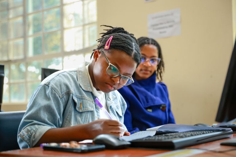 A group of young female students in a computer lab